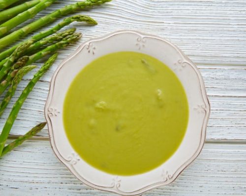 asparagus-soup-green-cream-white-wood-table_79295-4952
