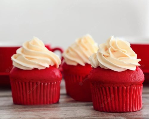 delicious-red-velvet-cupcakes-table_392895-105948