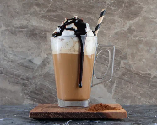 glass-foamy-cold-coffee-with-whipped-cream-chocolate-wooden-plate_114579-90914