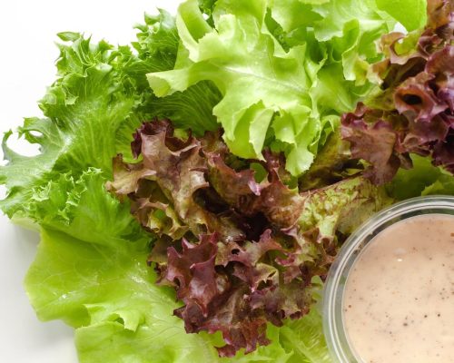 lettuce-with-homemade-salad-dressing-white-background-heathy-eating-concept_9555-303