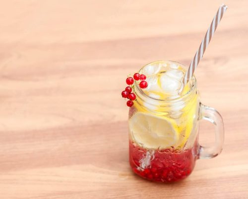 summer-cool-drink-quench-thirst-from-lemon-currant-with-ice-cubes-table-summer-backg_326533-881