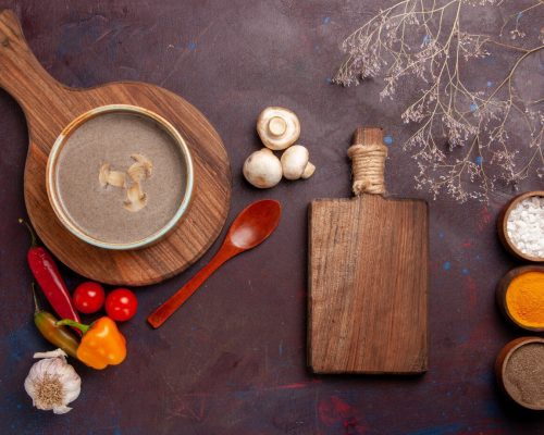 top-view-tasty-mushroom-soup-with-different-seasonings-dark-desk-soup-mushroom-seasoning-food-meal_140725-80747