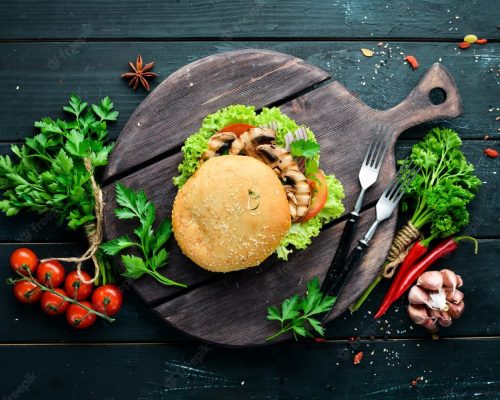 vegetarian-burger-with-mushrooms-vegetables-breakfast-top-view-free-space-your-text_187166-48194