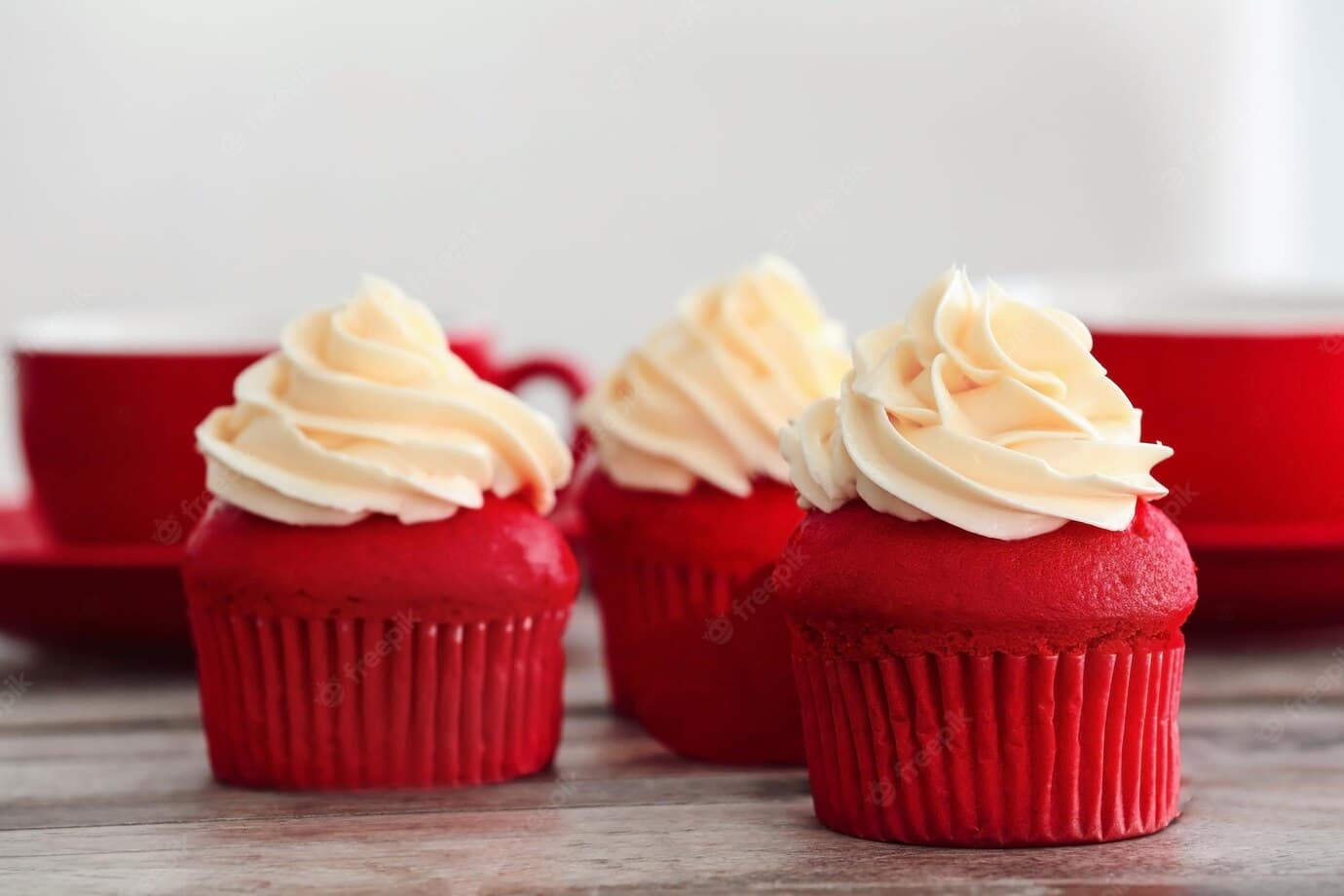 delicious-red-velvet-cupcakes-table_392895-105948